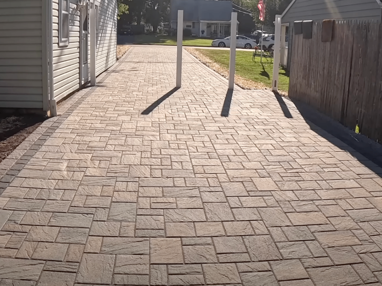 estimator measuring a Dayton driveway with a wheel and clipboard