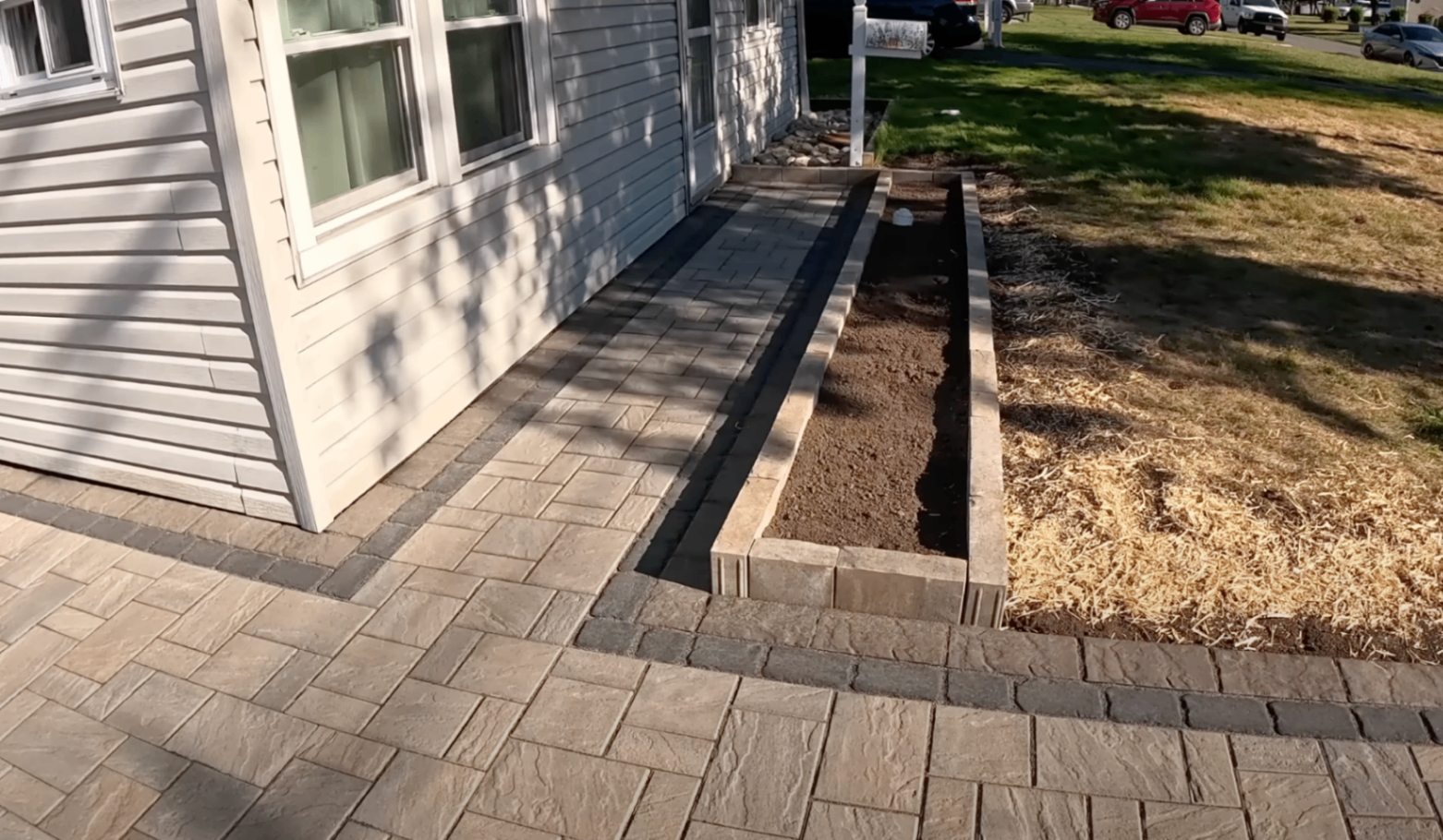 finisher cutting control joints into a fresh Dayton driveway with an early-entry saw