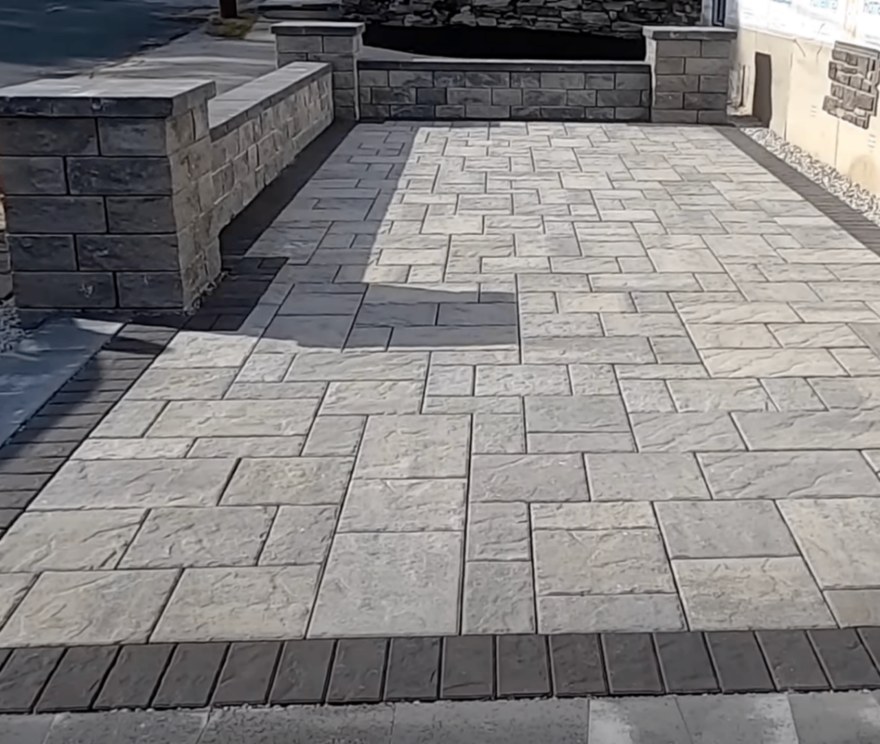 newly poured backyard patio with clean control joints behind a Centerville two-story